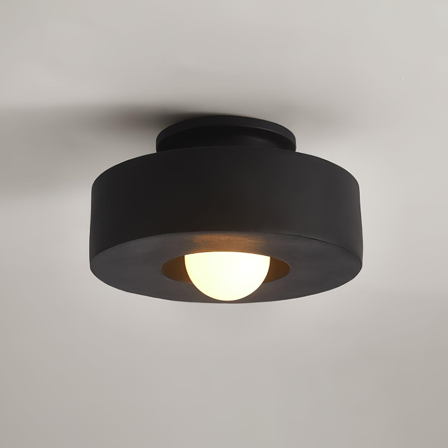 Plafonnier cylindrique à source lumineuse apparente