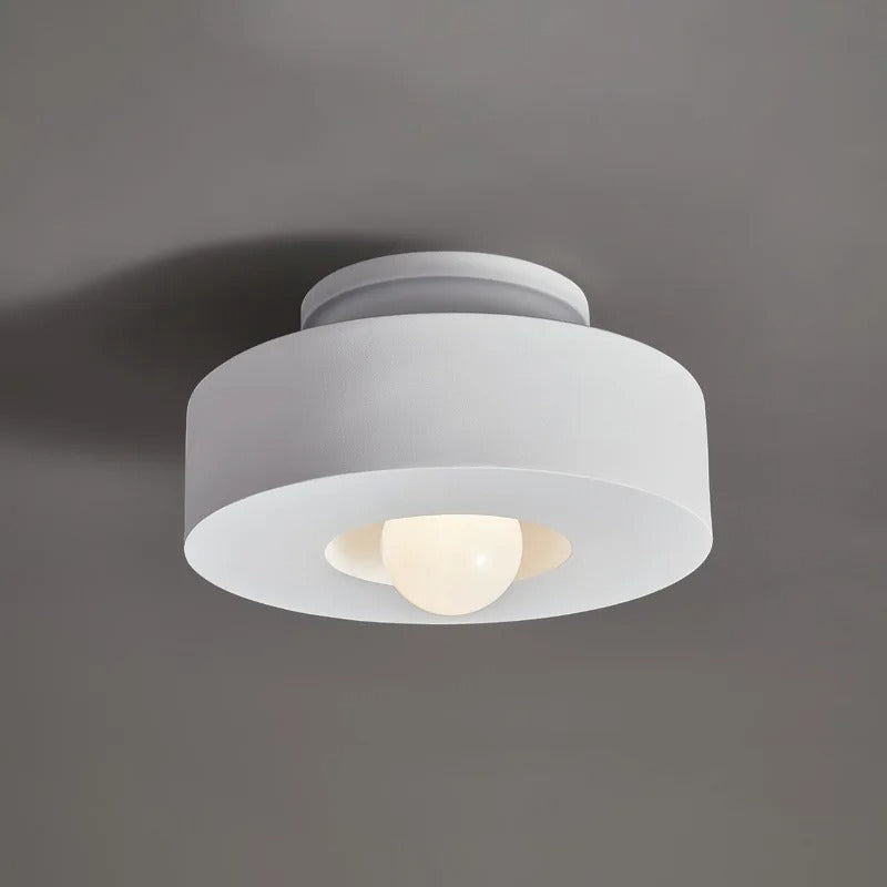 Plafonnier cylindrique à source lumineuse apparente