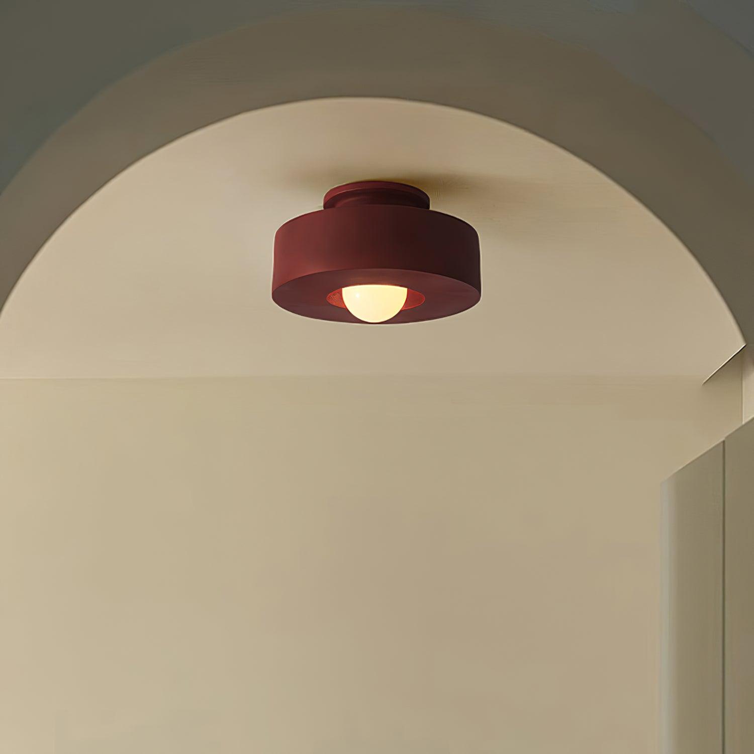 Plafonnier cylindrique à source lumineuse apparente
