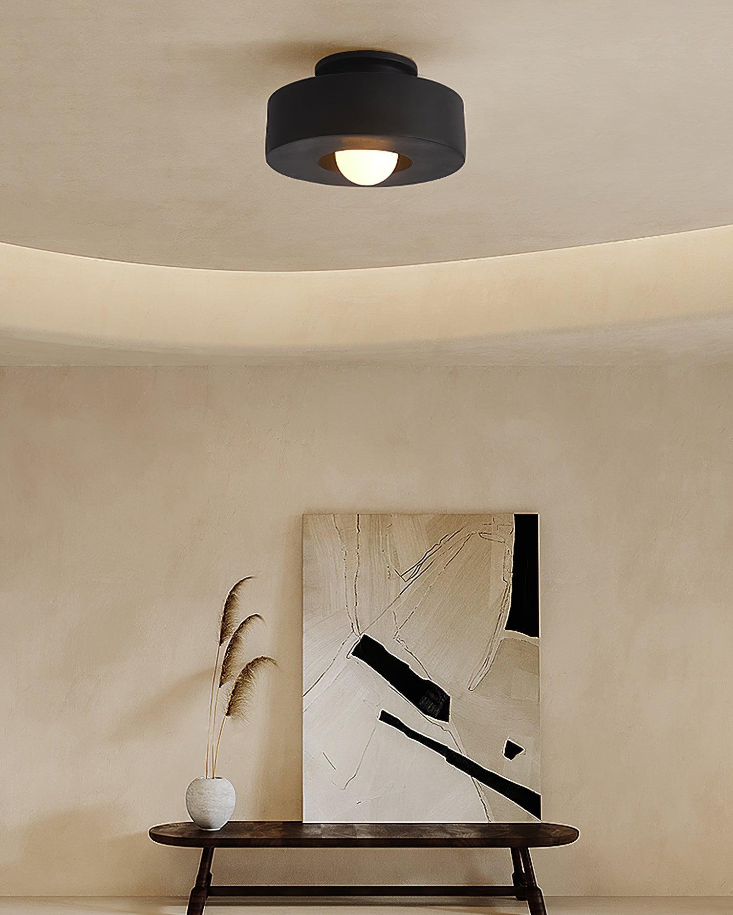 Plafonnier cylindrique à source lumineuse apparente