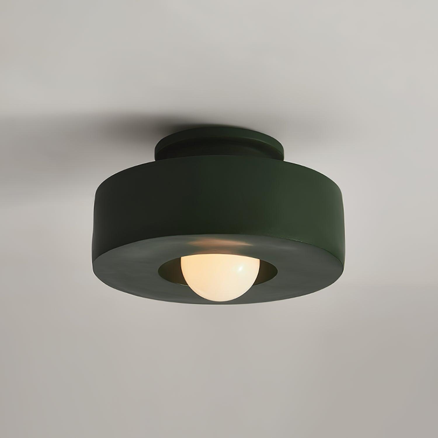 Plafonnier cylindrique à source lumineuse apparente