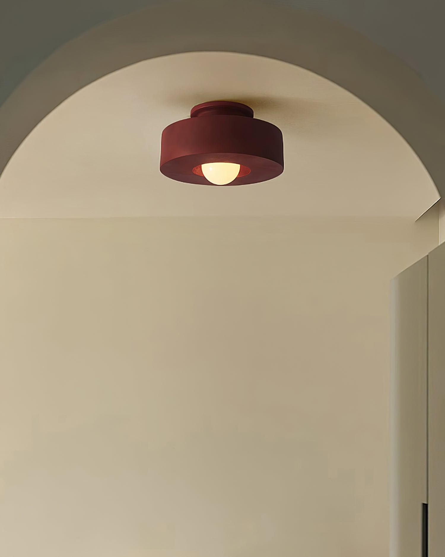 Plafonnier cylindrique à source lumineuse apparente
