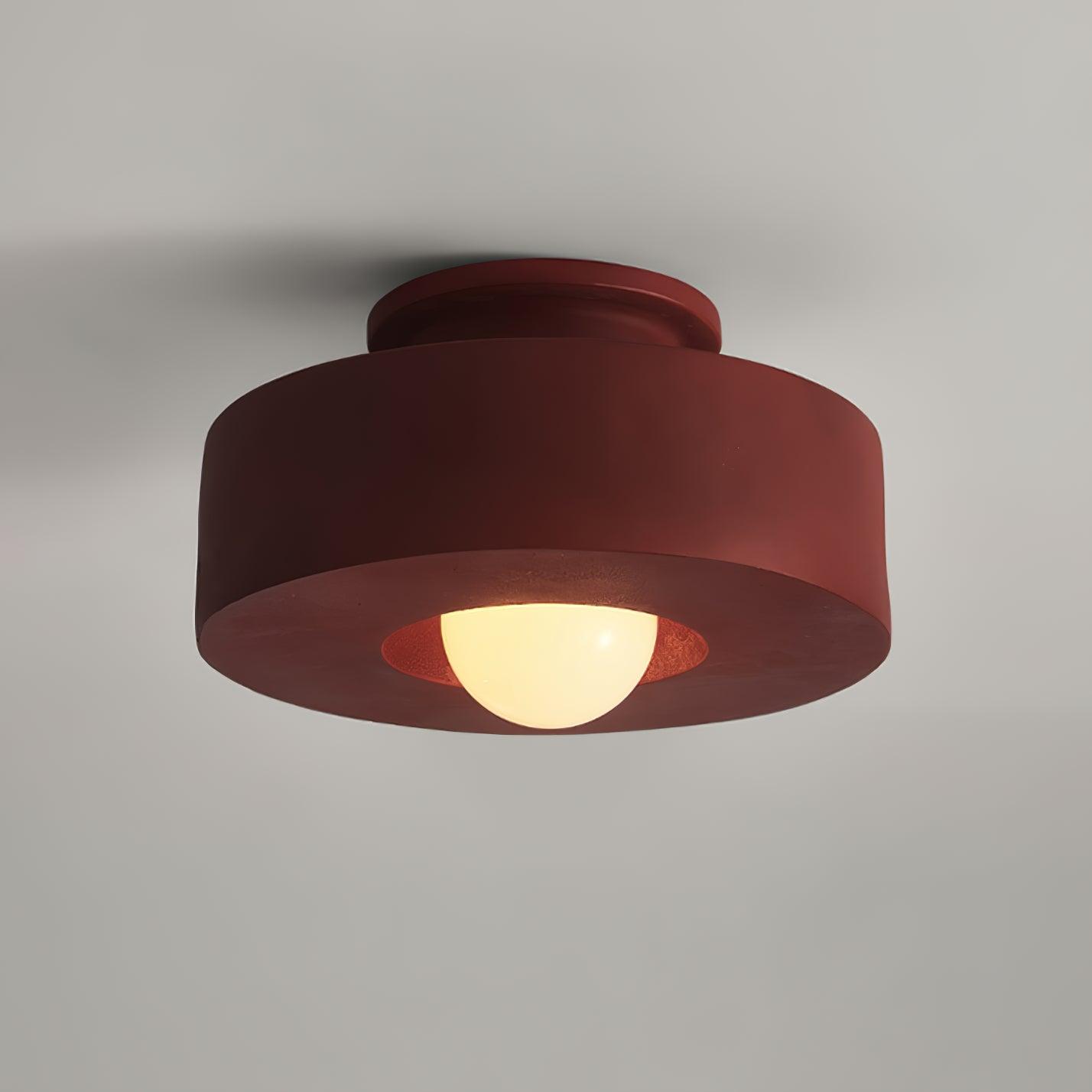 Plafonnier cylindrique à source lumineuse apparente